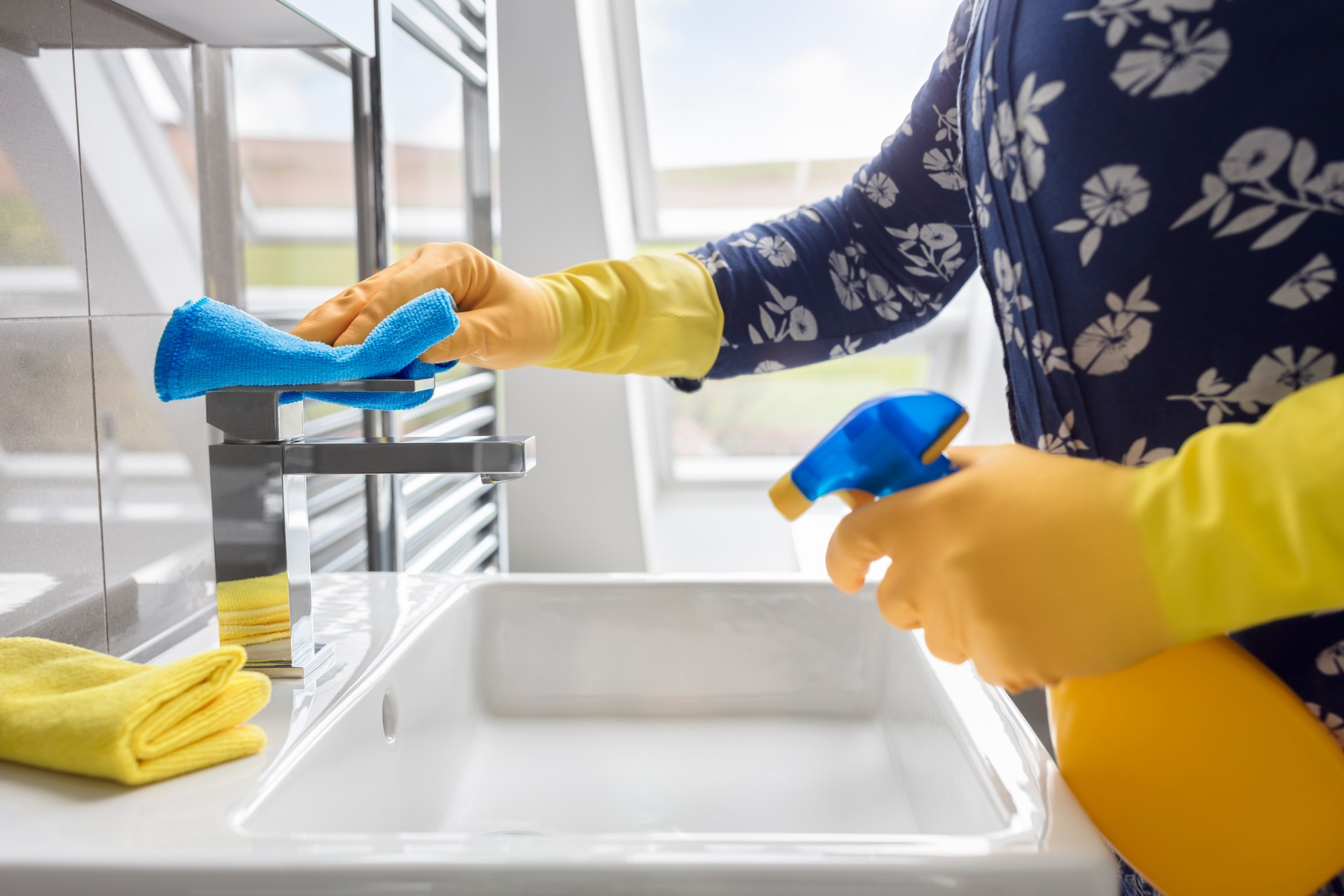 Cleaning sink and faucet with antibacterial detergent, corona virus prevention